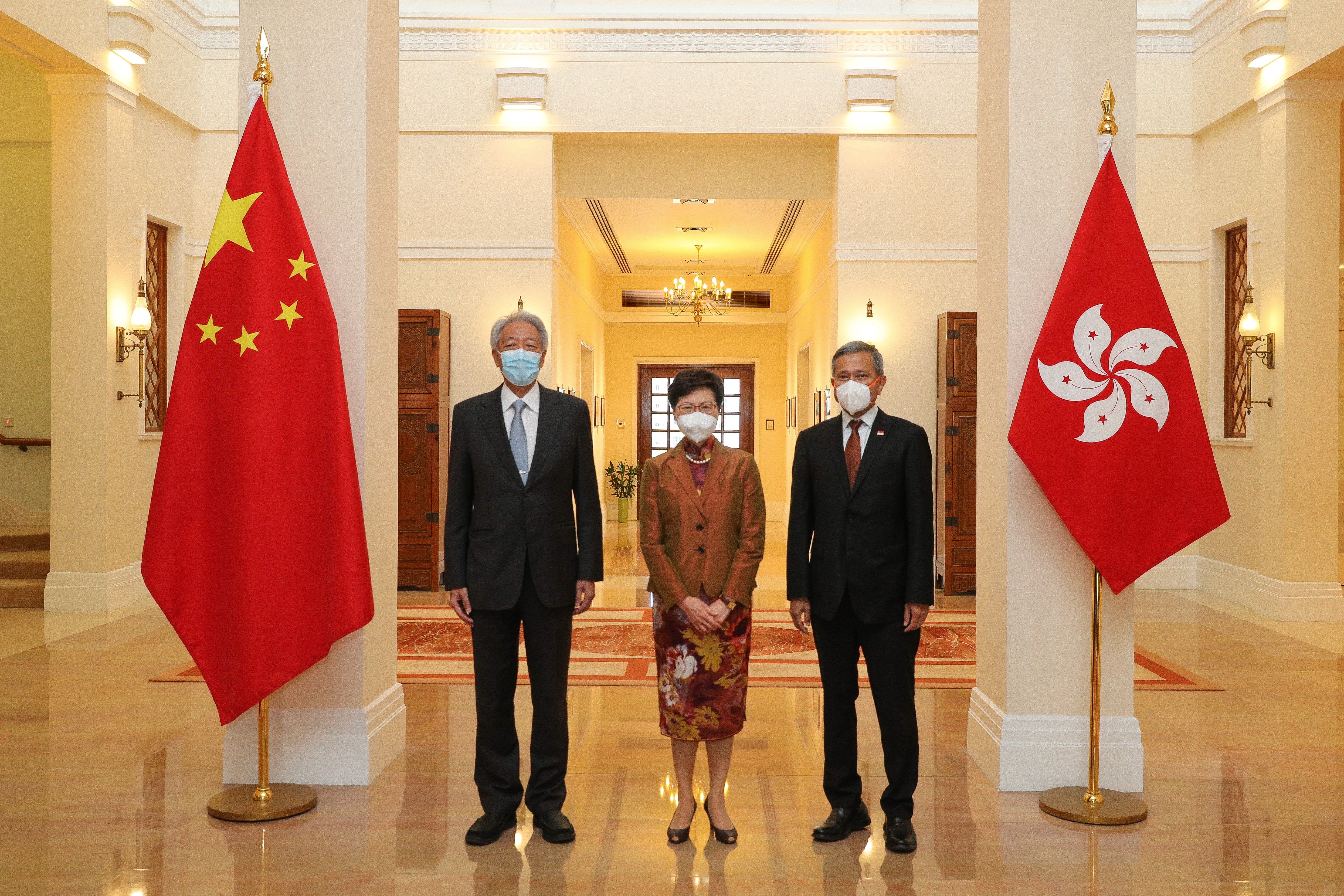 Senior Minister and Coordinating Minister for National Security Teo Chee Hean and Minister for Foreign Affairs Dr Vivian Balakrishnan with Chief Executive Carrie Lam